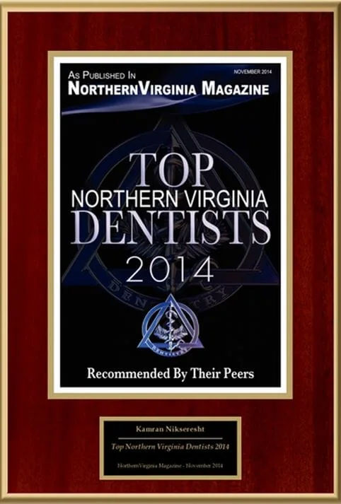 The image shows a framed award plaque for the  Top Northern Virginia Dentists 2014  with text that reads  Northern Virginia Magazine,  a blue ribbon, and a photo of a dentist s office.